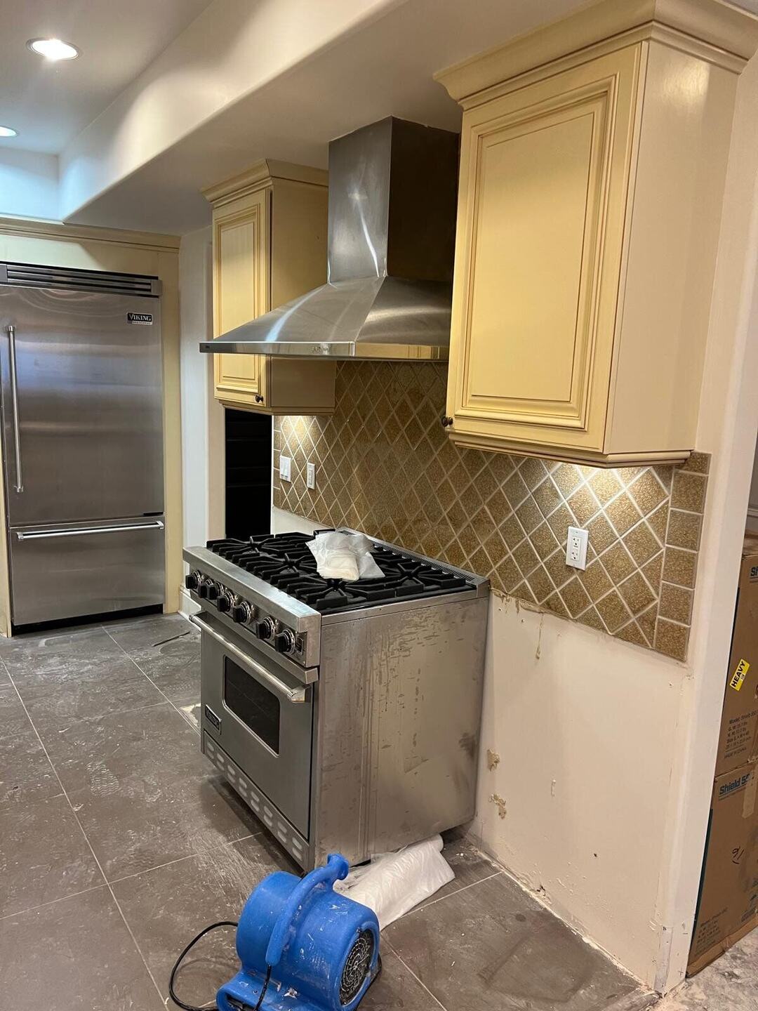 Air mover drying the kitchen during remediation